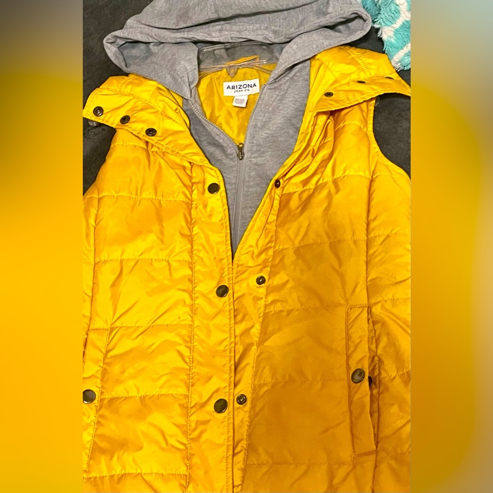WOMENS bright yellow zip up vest with under grey layer for warmth!